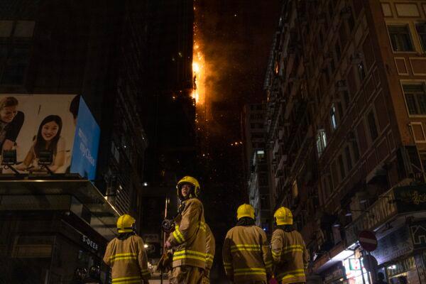 Firefighters battle a fire at a construction site in Hong Kong on March 3, 2023. (Louise Delmotte/AP Photo)