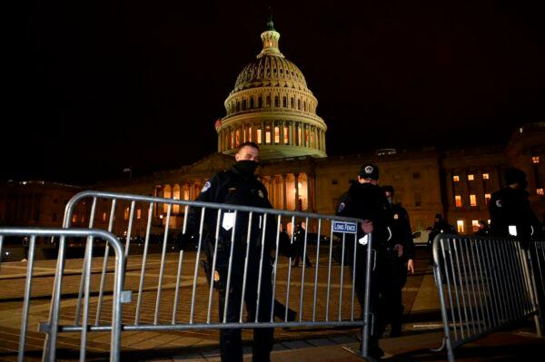 Police officers set up barricades outside of the U.S. Capitol in Washington on Jan. 6, 2021. (Andrew Caballero-Reynolds/AFP via Getty Images)