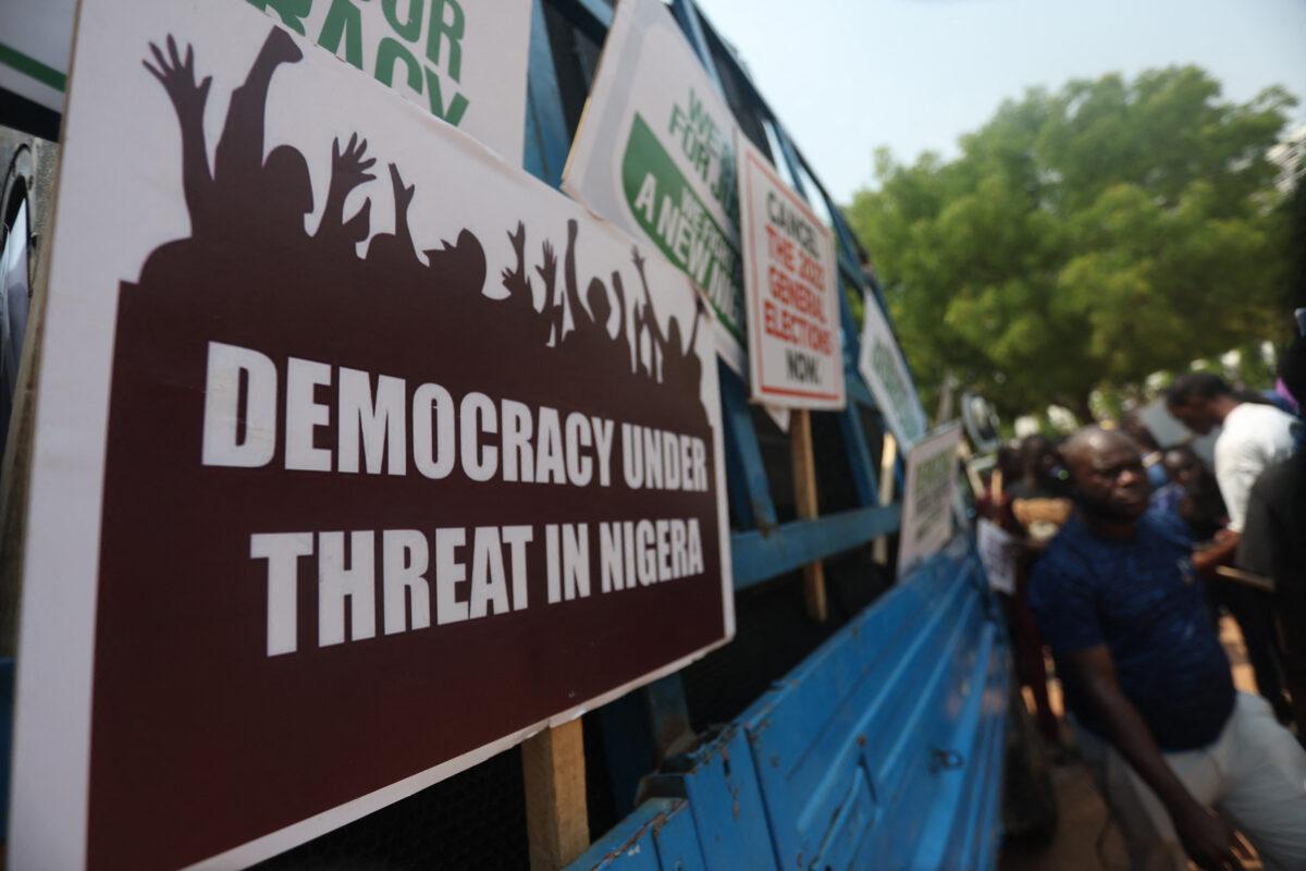 Placards are displayed on a vehicle as a group of people protest the outcome of the 2023 presidential election and the emergence of the candidate of All Progressives Congress' (APC) Bola Tinubu as the president-elect, in Abuja, Nigeria, on March 1, 2023. (Kola Sulaimon/AFP via Getty Images)