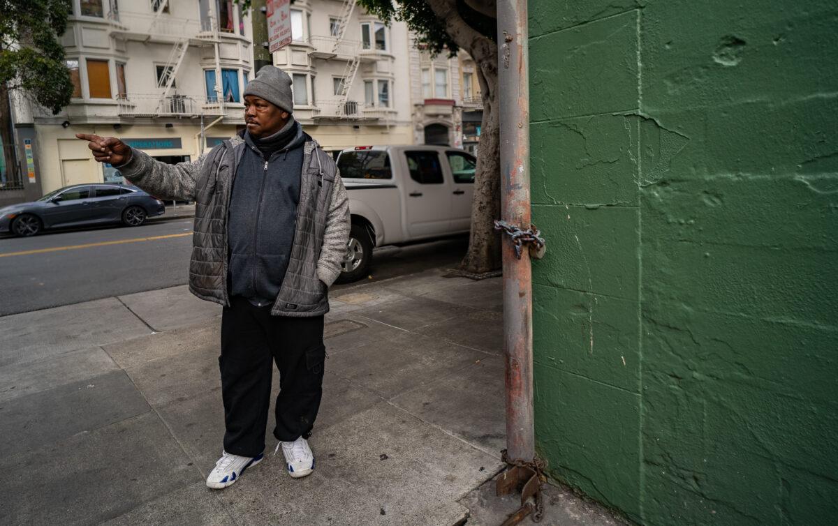 JJ Smith points to the area he last saw his brother alive on the streets of the Tenderloin District in San Francisco on Feb. 23, 2023. (John Fredricks/The Epoch Times)