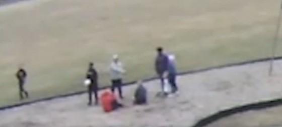 A screenshot from video released by the school district in Springfield, Ohio, showing a black student addressing one of three white students who were reportedly forced to kneel on the ground and say "black lives matter." (Springfield, Ohio School District)
