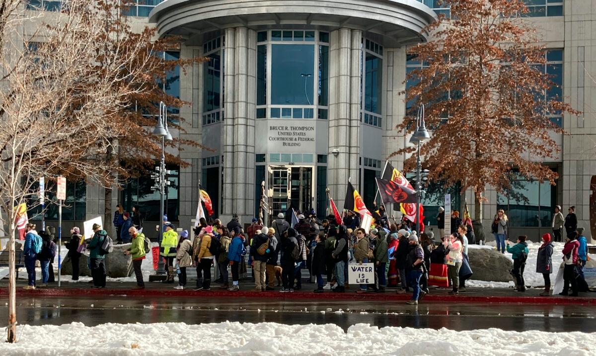 Dozens of tribe members and other protesters beating drums and waving signs rally in front of the federal courthouse in Reno, Nev., on Jan. 5, 2023, as a court hearing began over a lawsuit seeking to block a huge lithium mine planned near the Nevada-Oregon line about 200 miles north of Reno. (Scott Sonner/AP Photo)