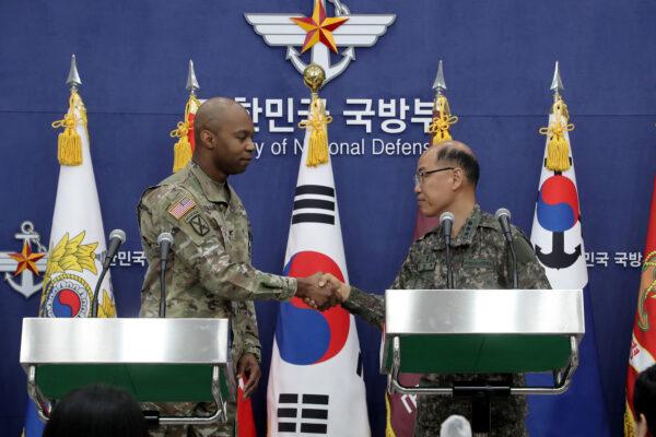 Col. Isaac Taylor, a spokesman for the U.S. military, and Col. Lee Sung-jun (R), a spokesman at South Korea’s Joint Chiefs of Staff, attend the press briefing for the 2023 Freedom Shield exercise at the Defense Ministry in Seoul, South Korea, on March 3, 2023. (Chung Sung-Jun/Pool via Reuters)