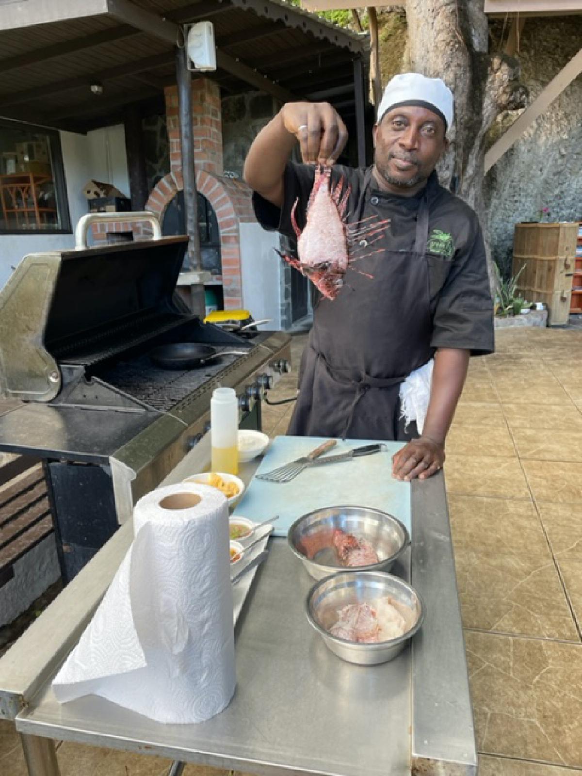 The Green Fig’s Chef Wesley teaches a safe and tasty way to dispose of lionfish, an invasive species in the Caribbean. (Photo courtesy of Lesley Frederikson)