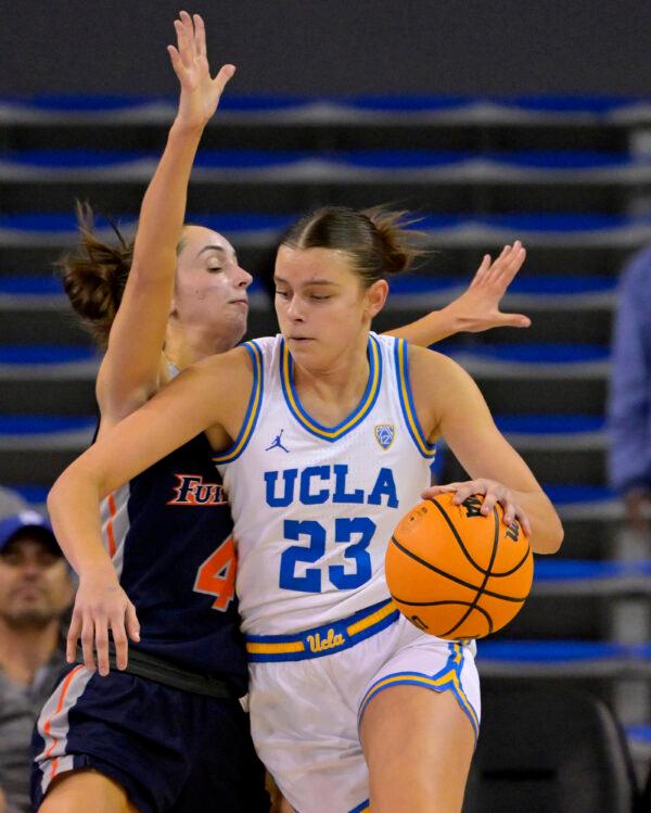 Gabi Vidmar (4) of the CSU Fullerton Titans guards Gabriela Jaquez (23) of the UCLA Bruins in the first half at UCLA Pauley Pavilion in Los Angeles on Dec. 10, 2022. (Jayne Kamin-Oncea/Getty Images)