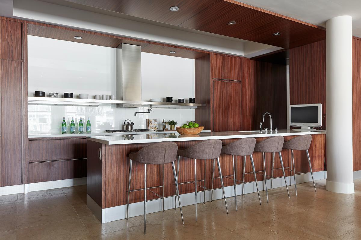 Shelves serve as an alternative to cabinetry in this modern kitchen. (Scott Gabriel Morris/TNS)