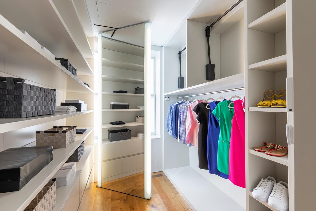 Bins and boxes add to the organization in a primary bedroom closet. (Handout/TNS)