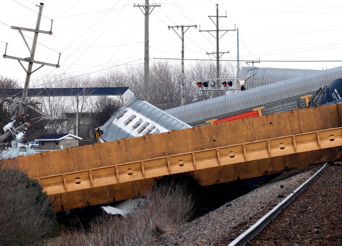 Multiple cars of a Norfolk Southern train lie toppled on one another after derailing at a train crossing with Ohio 41 in Clark County, Ohio, on March 4, 2023. (Bill Lackey/Springfield-News Sun via AP)