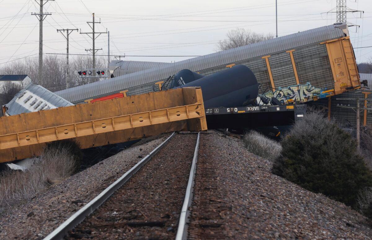 Multiple cars of a Norfolk Southern train lie toppled after derailing at a train crossing with Ohio 41 in Clark County, Ohio, on March 4, 2023. (Bill Lackey/Springfield-News Sun via AP)