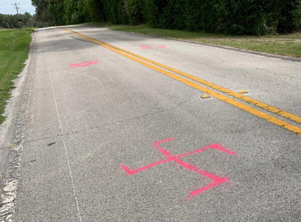 A spray-painted swastika, a Nazi symbol, appears on a road in Volusia County, Fla., near a spray-painted six-pointed star, known as the Star of David, a symbol of Judaism, in an undated photo. (Courtesy of Rachel Cohen)