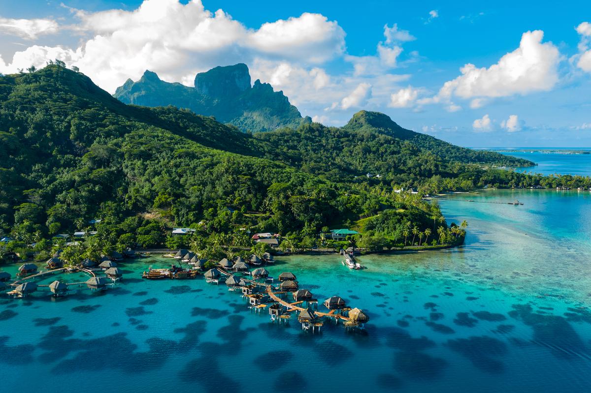 An aerial view of overwater bungalows in Bora Bora. (Maridav/Shutterstock)