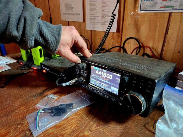 Fortitude Ranch Nevada Manager Brandon M. demonstrates a ham radio on March 2, 2023. (Allan Stein/The Epoch Times)