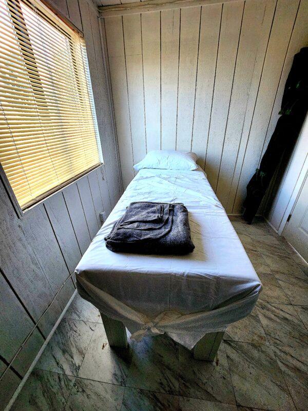 The medical clinic at Fortitude Ranch Nevada includes a single bed, on March 2, 2023. (Allan Stein/The Epoch Times)