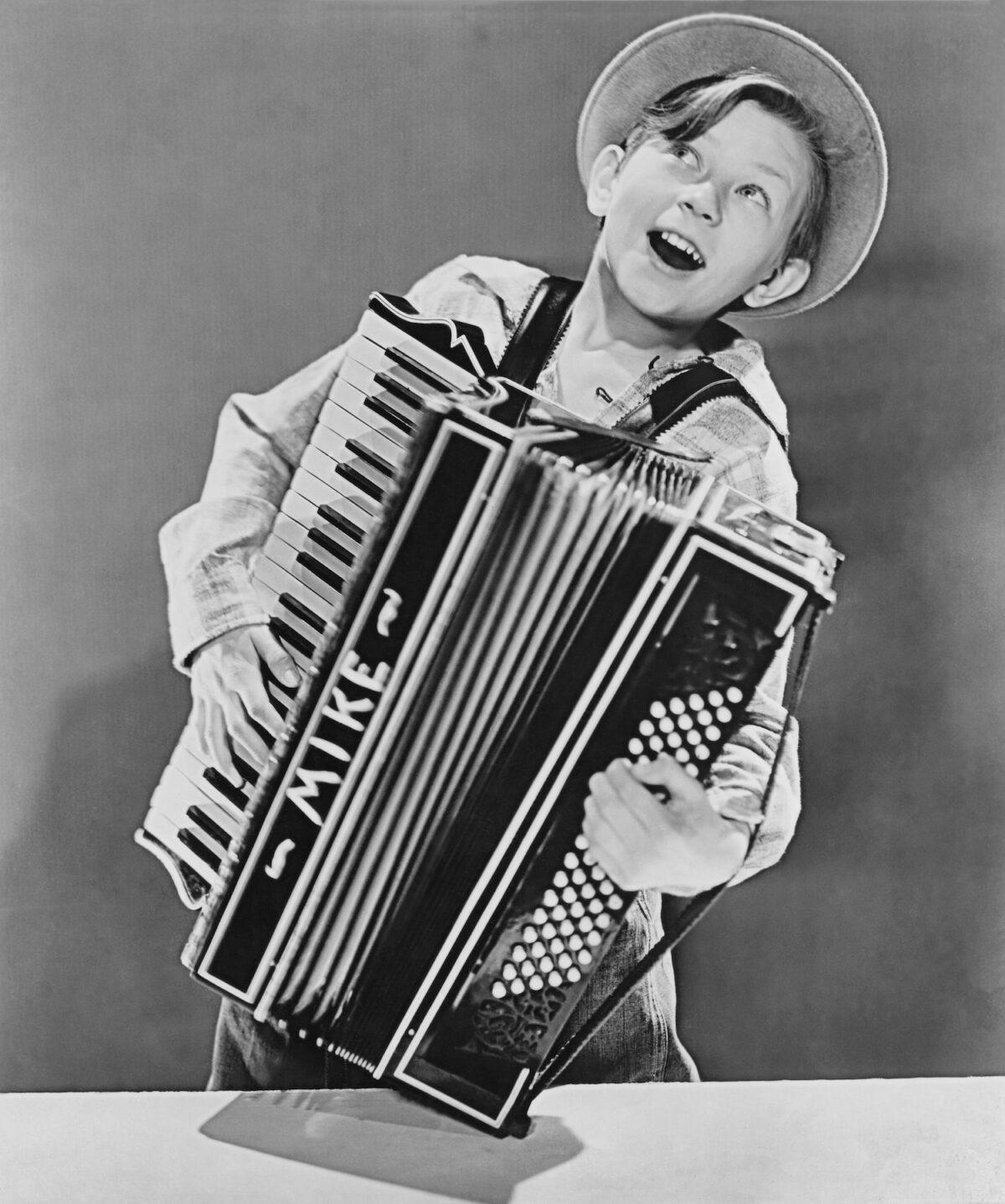 American actor Donald O'Connor playing the accordion at age 12 in 1938. (Pictorial Parade/Archive Photos/Getty Images)
