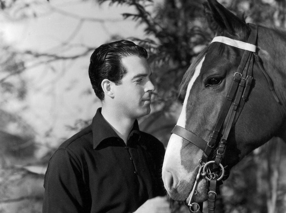 American actor Fred MacMurray holds the reins of his horse, Star, in 1936. (Hulton Archive/Getty Images)