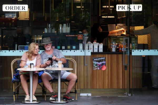 Diners sit outside a cafe at Circular Quay in Sydney, Australia, on Feb. 25, 2022. (Lisa Maree Williams/Getty Images)