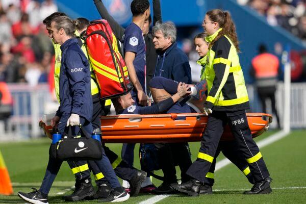 PSG's Neymar is carried off the field on a stretcher after after injuring during the French League One soccer match between Paris Saint-Germain and Lille at the Parc des Princes stadium in Paris on Feb. 19, 2023. (Christophe Ena/AP Photo)