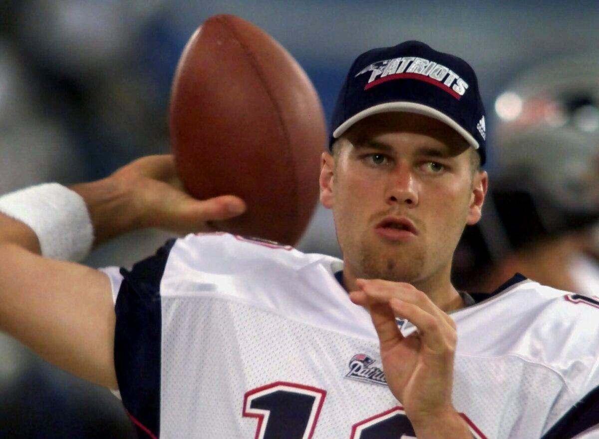 New England Patriots backup quarterback Tom Brady warms up on the sidelines before the game against the Detroit Lions at the Silverdome in Pontiac, Mich., on Aug. 4, 2000. (Carlos Osorio/AP Photo)