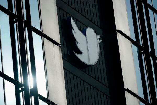 A Twitter logo hangs outside the company's offices in San Francisco on Dec. 19, 2022. (Jeff Chiu/AP Photo)