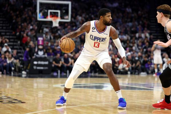 Paul George (13) of the LA Clippers dribbles the ball against the Sacramento Kings at Golden 1 Center in Sacramento on March 3, 2023.(Ezra Shaw/Getty Images)