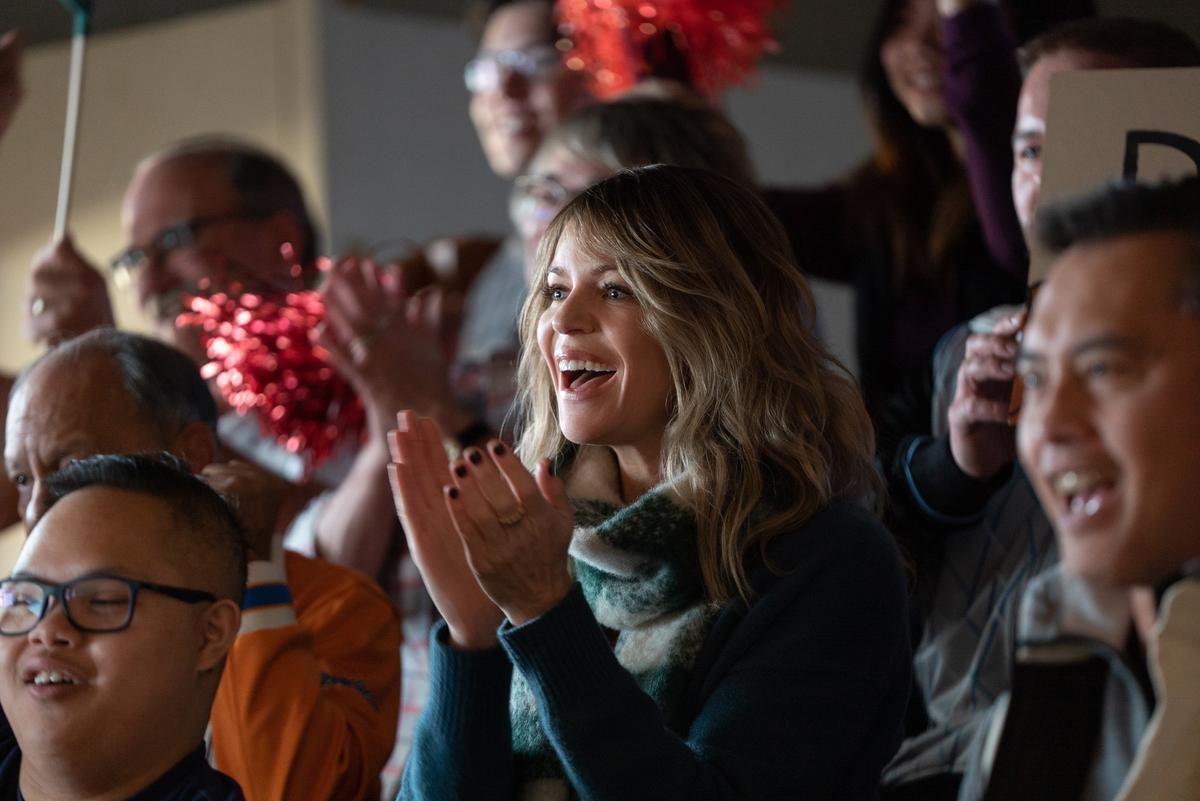 Alex (Kaitlin Olson, center) cheers her brother in "Champions." (Focus Features)
