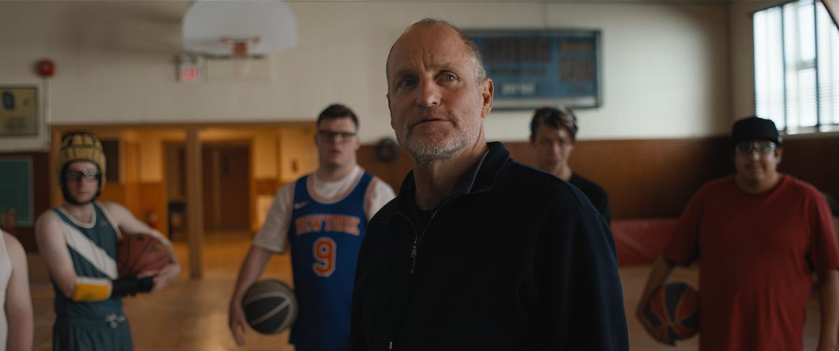 Marcus (Woody Harrelson), newly appointed coach of the Friends basketball team, and a few of his players in "Champions." (Focus Features)