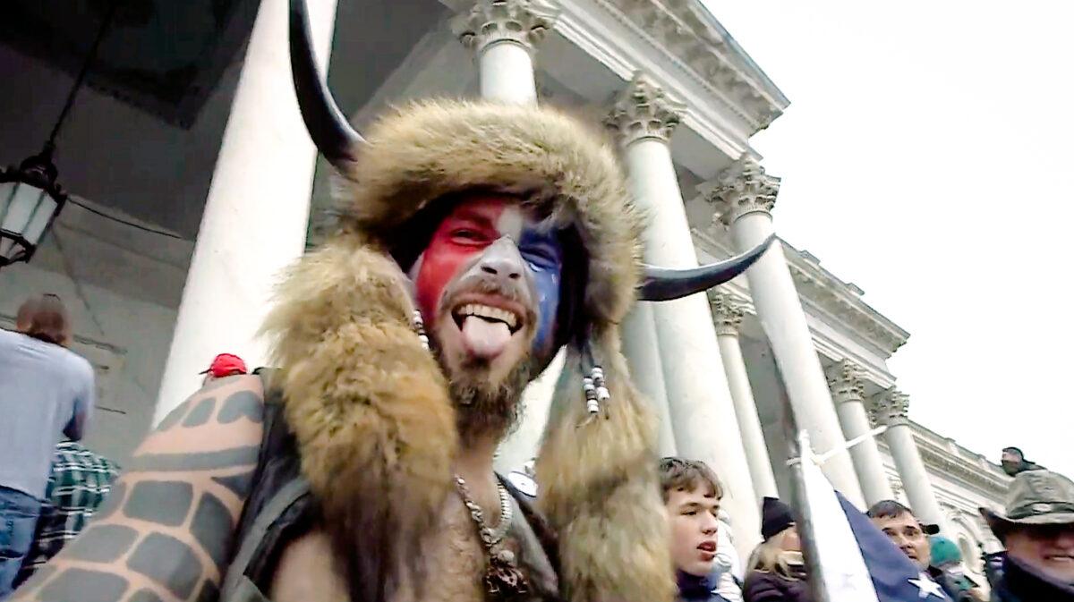 Jacob Chansley, the "QAnon Shaman," was escorted around the U.S. Capitol on Jan. 6, Fox News contended in a special aired on March 6. (U.S. Department of Justice/Screenshot via The Epoch Times)