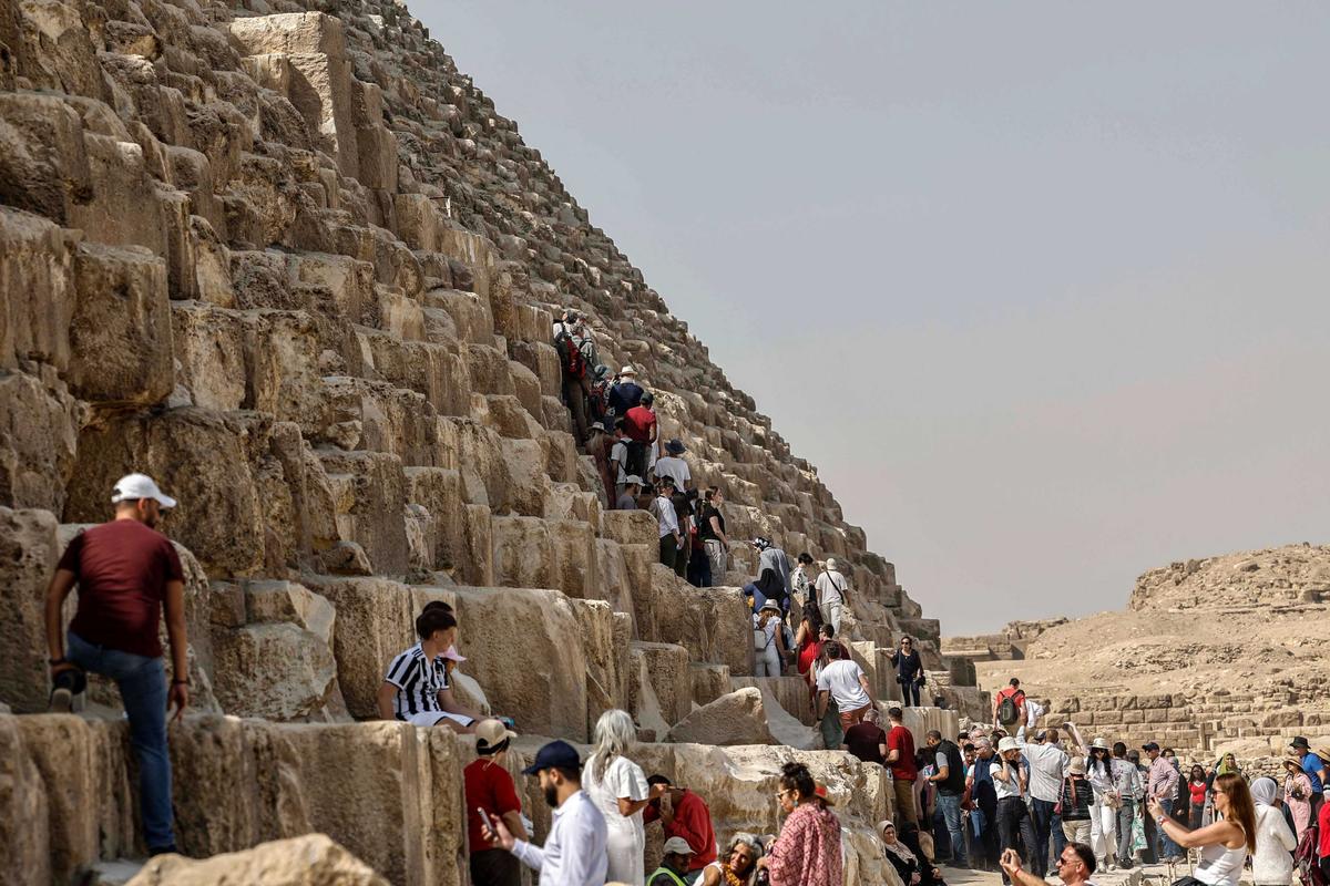 Tourists visit the Great Pyramid of Giza. (Khaled Desouki/AFP via Getty Images)