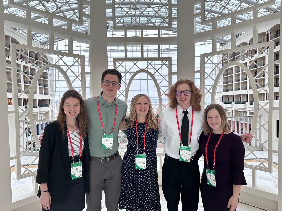 From left, five Liberty University students–Ava Bear, James DuVall, Kristen Pace, Micah Gilmer, Kristina Smith–pose for a photo during CPAC on March 2, 2023. (Janice Hisle/The Epoch Times)