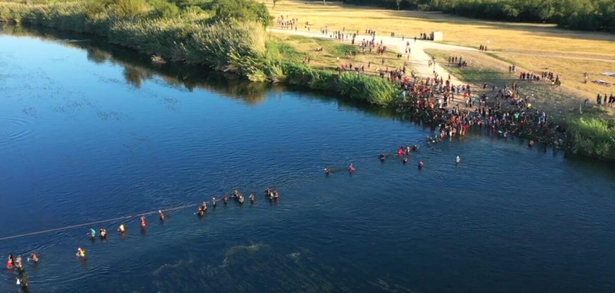 People illegally cross the U.S.-Mexico border on the Rio Grande River from Mexico as shown in the EpochTV documentary, "Border Deception." (Screenshot/The Epoch Times)
