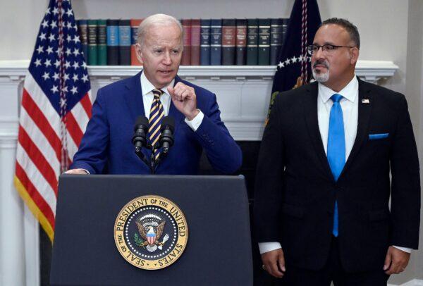 President Joe Biden announces student loan relief with Education Secretary Miguel Cardona in the Roosevelt Room of the White House on Aug. 24, 2022. (Olivier Douliery/AFP via Getty Images)
