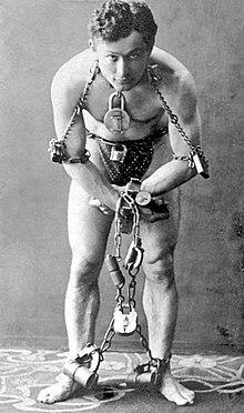 Harry Houdini's famous escape artist trick amazed audiences. (Public Domain)