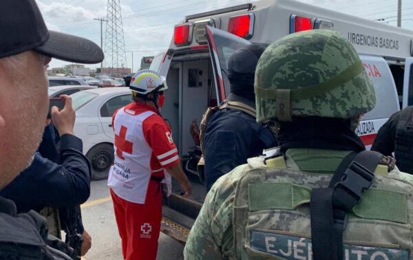 A Red Cross worker closes the door of an ambulance carrying two Americans found alive after their abduction in Mexico last week, in Matamoros, Mexico, on March 7, 2023. (AP Photo)