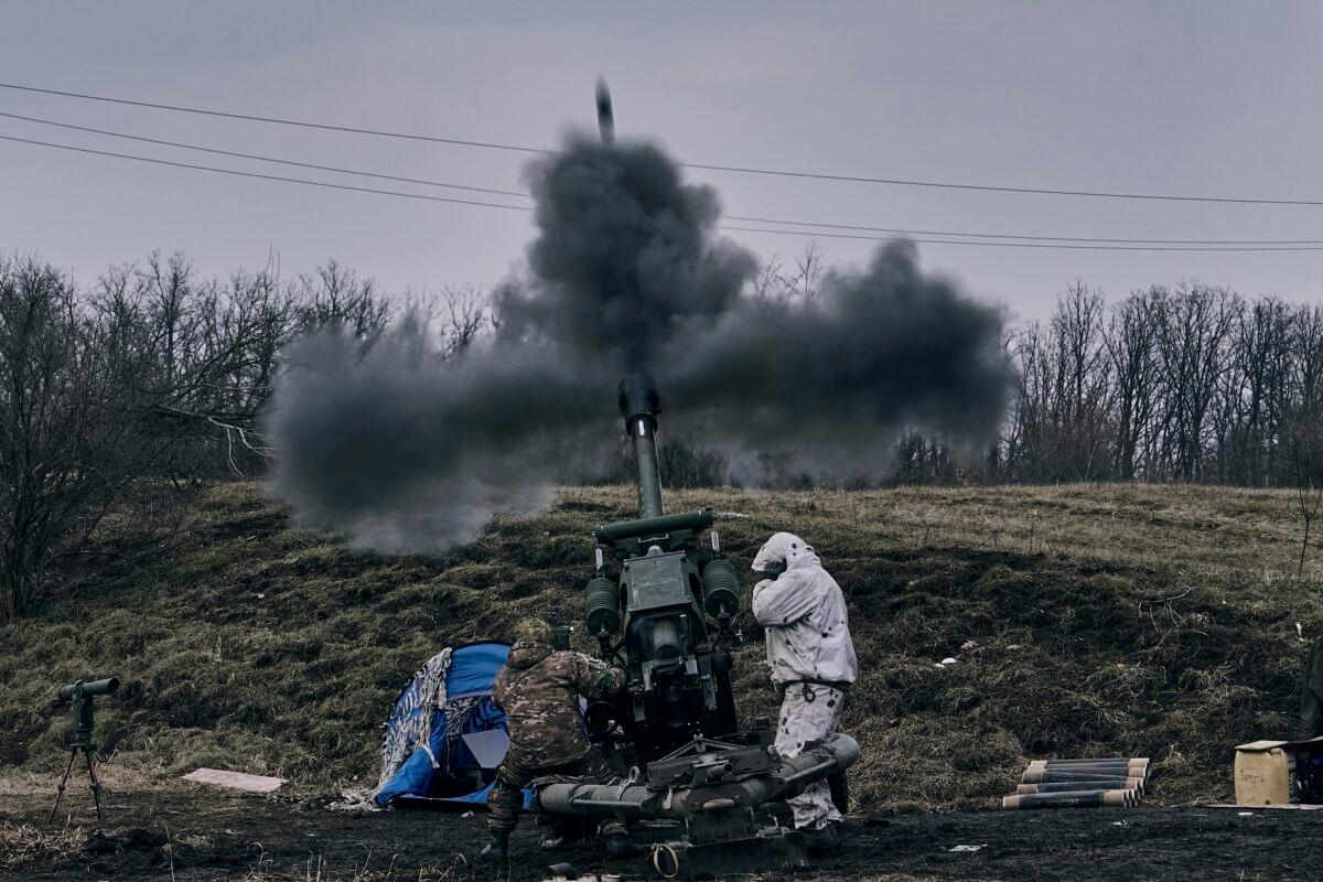 Ukrainian soldiers fire a self-propelled howitzer toward Russian positions near Bakhmut, the site of the heaviest battles, in the Donetsk region of Ukraine, on March 7, 2023. (Libkos/AP Photo)