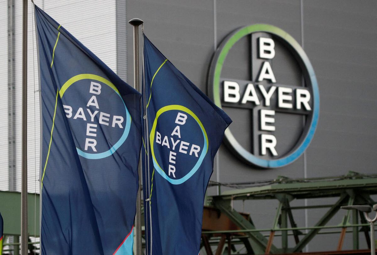 Logo and flags of Bayer AG are pictured outside a plant of the German pharmaceutical and chemical maker in Wuppertal, Germany, on Aug. 9, 2019. (Wolfgang Rattay/Reuters)