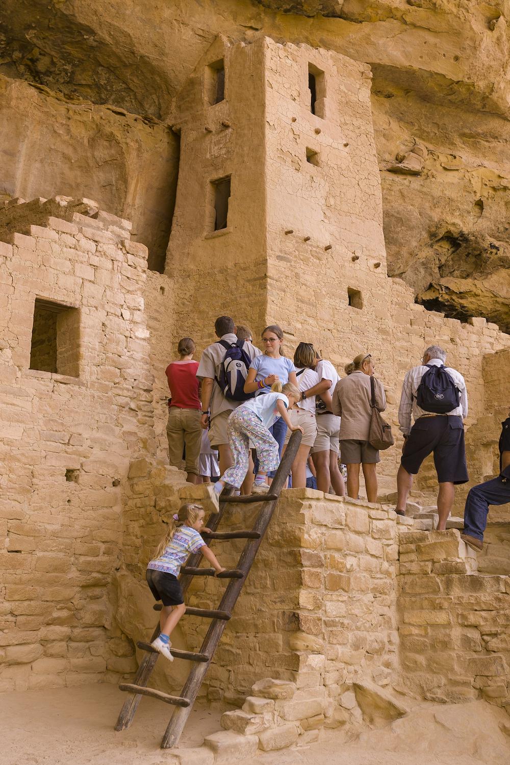 Modern visitors explore the remains of Cliff Palace. (Rob Crandall/Shutterstock)