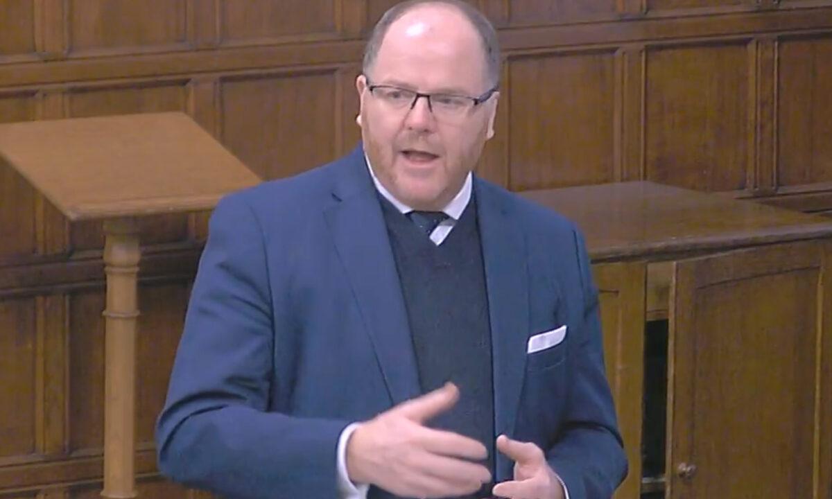 George Freeman, minister of state in the Department for Science, Innovation, and Technology, speaking in Parliament in London on March 8, 2023. (Screenshot via The Epoch Times)