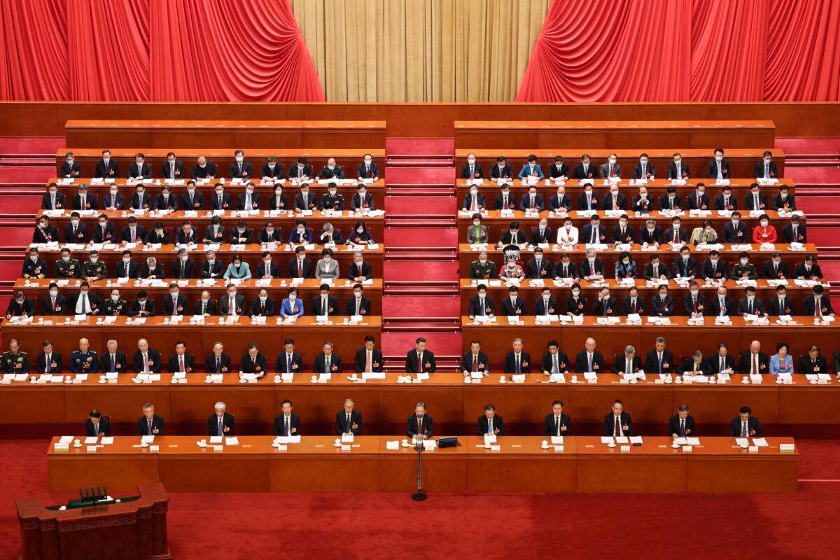 Chinese leader Xi Jinping (center, at foot of stairs) attends the opening of the first session of the 14th National People's Congress at The Great Hall of the People in Beijing, on March 5, 2023. (Lintao Zhang/Getty Images)