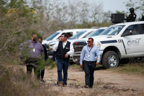 Tamaulipas attorney general's office personnel walk at the scene where authorities found the bodies of two of four Americans kidnapped by gunmen, in Matamoros, Mexico, on March 7, 2023. (Daniel Becerril/Reuters)