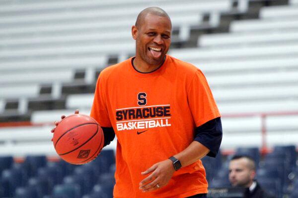 Syracuse assistant coach Adrian Autry jokes with players before an NCAA college basketball in the NIT against Mississippi in Syracuse, N.Y., on March 18, 2017. (Nick Lisi/AP Photo)