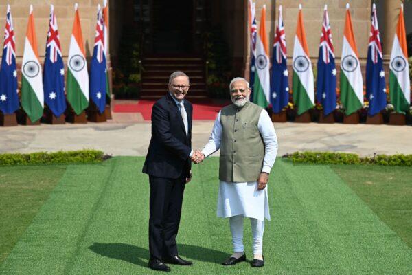 Indian Prime Minister Narendra Modi (R) shakes hands with Australia's Prime Minister Anthony Albanese before a meeting at Hyderabad House in New Delhi on March 10, 2023. (Money Sharma/AFP via Getty Images)