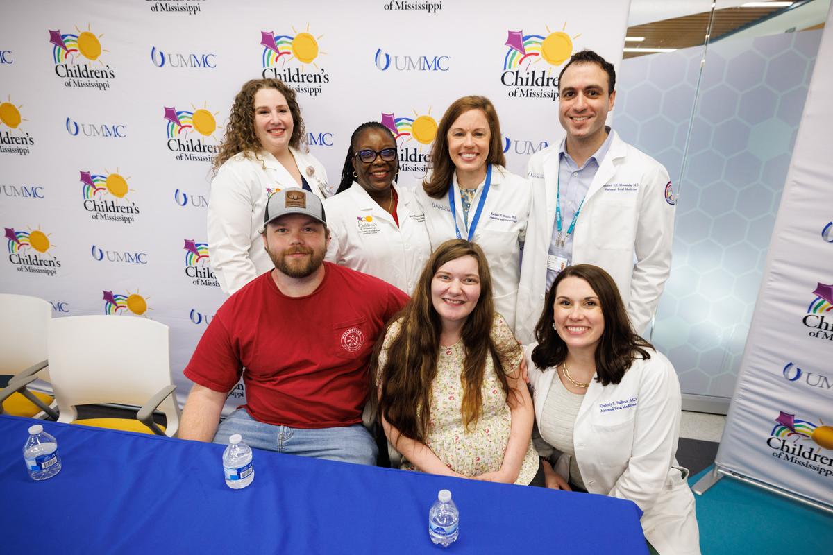 Shawn and Haylee Ladner are surrounded by members of their care team at UMMC. (L-R): Dr. Ashley Doucet, Dr. Mobolaji Famuyide, Dr. Rachael Morris, Dr. Ahmed S.Z. Moustafa, and Dr. Kimberly Sullivan. (Courtesy of UMMC Communications and Marketing)