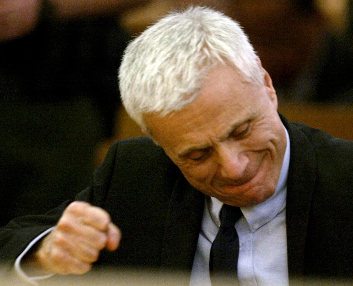 Robert Blake reacts after hearing the verdicts read in his murder trial for the death of his wife Bonny Lee Bakley in Los Angeles on March 16, 2005. (Nick Ut/AP Photo)
