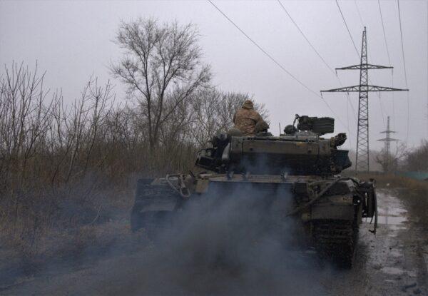 A Ukrainian T-64 tank rolls along a muddy lane from the town of Chasiv Yar, Donetsk region to Bakhmut, Ukraine, on March 9, 2023. (Sergey Shestak/AFP via Getty Images)