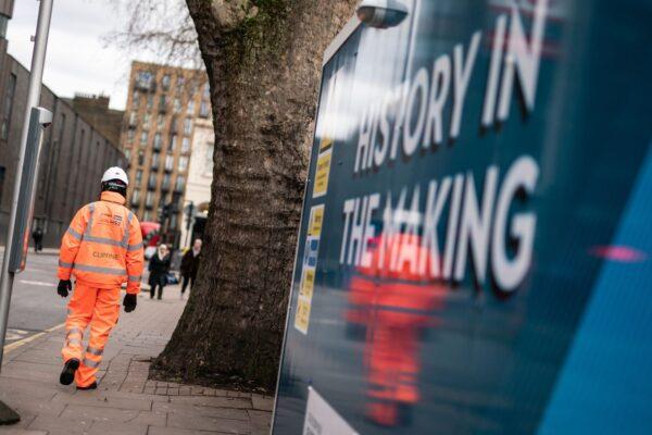 An HS2 construction worker walks past the Euston station site in central London on Jan. 27, 2023. (PA Media)