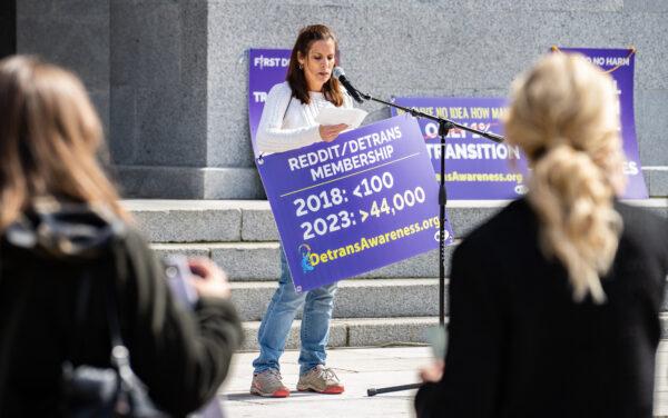 Erin Friday checks her notes on the steps of the California State Capitol in Sacramento, Calif., on March 10, 2023. (John Fredricks/The Epoch Times)
