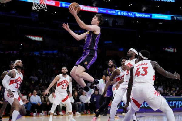 Los Angeles Lakers guard Austin Reaves, top center, drives to the basket against the Toronto Raptors during the first half of an NBA basketball game in Los Angeles on March 10, 2023. (Marcio Jose Sanchez/AP Photo)