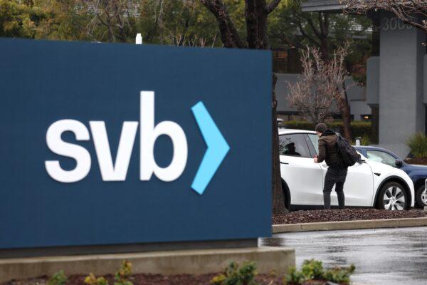 An employee gets into his car after arriving to work at the shuttered Silicon Valley Bank (SVB) headquarters in Santa Clara, Calif., on March 10, 2023. (Justin Sullivan/Getty Images)