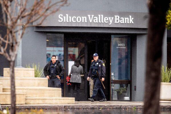 Police officers leave Silicon Valley Banks headquarters in Santa Clara, Calif., on March 10, 2023. (Noah Berger/AFP via Getty Images)