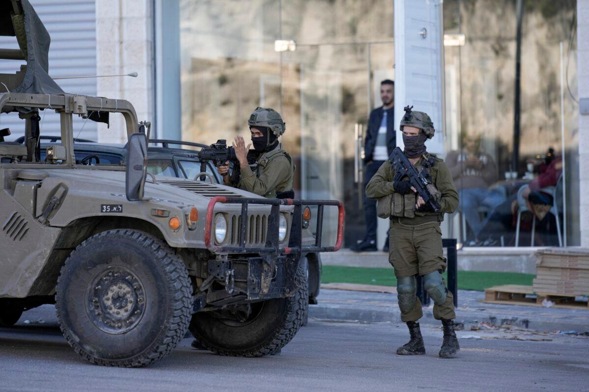 Israeli soldiers operate in village of Sarra near the West Bank city of Nablus on March 12, 2023. (Majdi Mohammed/AP Photo)